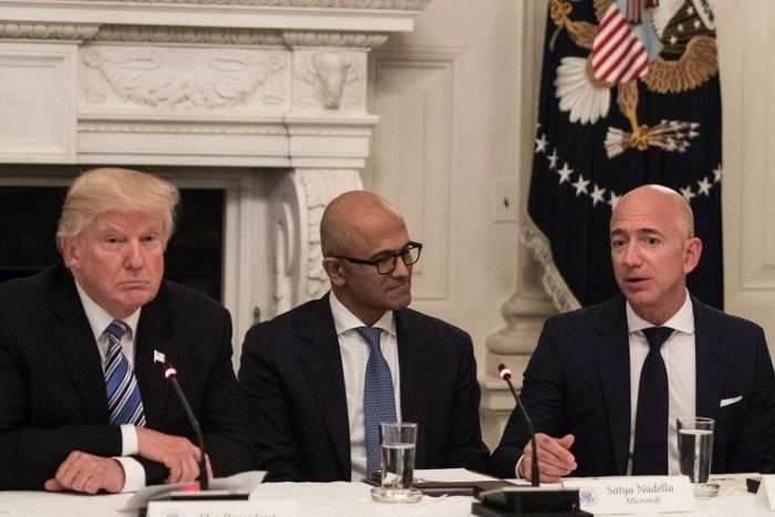 US President Donald Trump, pictured with Microsoft CEO Satya Nadella and Amazon CEO Jeff Bezos business roundtable at the White House on June 19, has renewed his criticism of Amazon, claiming the online giant is harming other retailers