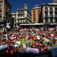 People display flowers and candles to pay tribute to the victims of the Barcelona and Cambrils attacks on the Rambla boulevard in Barcelona on August 22, 2017, five days after the attacks that killed 15 people.