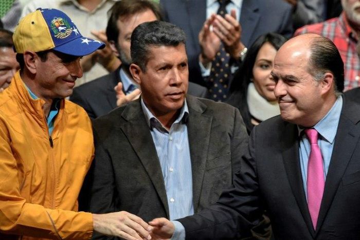 (L-R) Opposition leader Henrique Capriles Radonski, Lara State governor Henry Falcon and the president of the Venezuelan National Assembly Julio Borges during a meeting with different sectors of the civil society