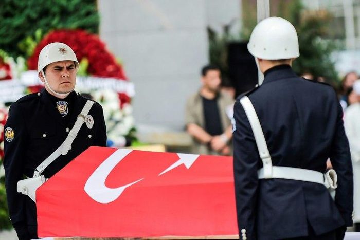 Turkish police stand next to the coffin of slain colleague Sinan Acar during his funeral ceremony in Istanbul on August 14, 2017