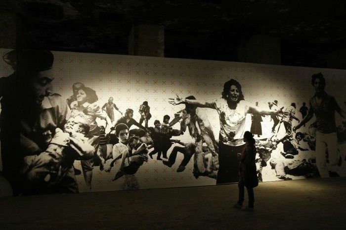 A woman visits a photography exhibition about Lebanon's 1975-1990 civil war in Beirut on April 13, 2010