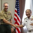 General Joseph Dunford (L), the chairman of the US Joint Chiefs of Staff, shakes hands with Japan's Chief of Staff of Joint Staff Katsutoshi Kawano (R) at the start of their talks at the Defence Ministry in Tokyo