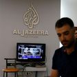 An employee of Qatar-based Al-Jazeera at the broadcaster's Jerusalem office on July 31, 2017