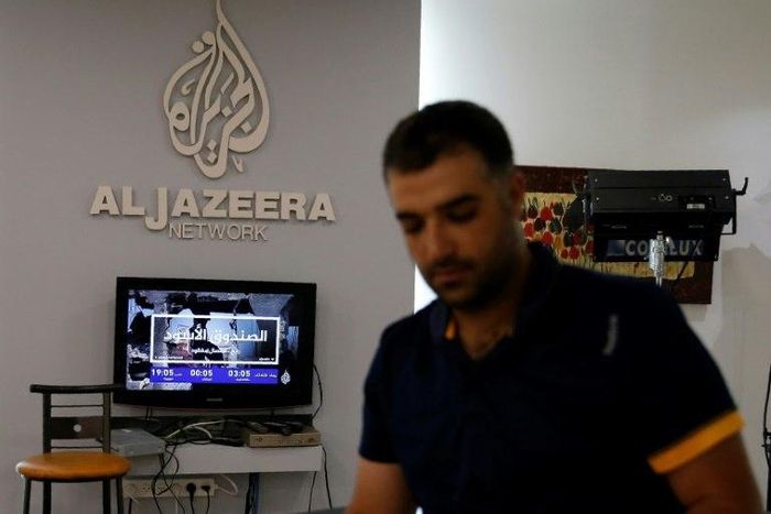 An employee of Qatar-based Al-Jazeera at the broadcaster's Jerusalem office on July 31, 2017