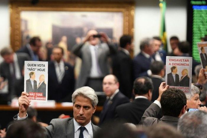 Representatives of the opposition protest in the lower house's Committee on Constitution and Justice against the veto to the report authorizing the opening of proceedings in the Supreme Court against President Temer, in Brasilia, on July 13, 2017
