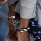 A woman in handcuffs