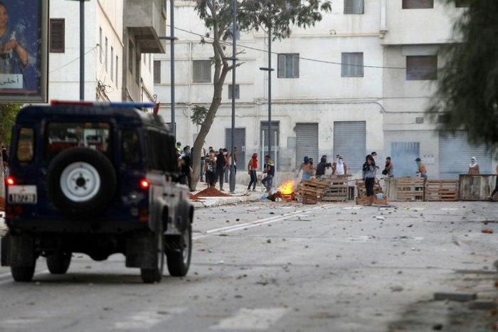 Demonstrators clash with Moroccan security forces on July 20, 2017, in the northern restive city of Al-Hoceima