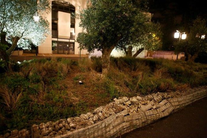 A damaged wall outside a mosque in the Paris suburb of Creteil is seen June 29, 2017 after a man tried to drive a car into a crowd in front of the Islamic religious facility