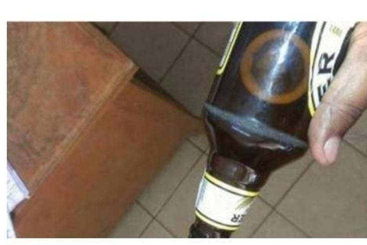 The condom in the beer bottle.