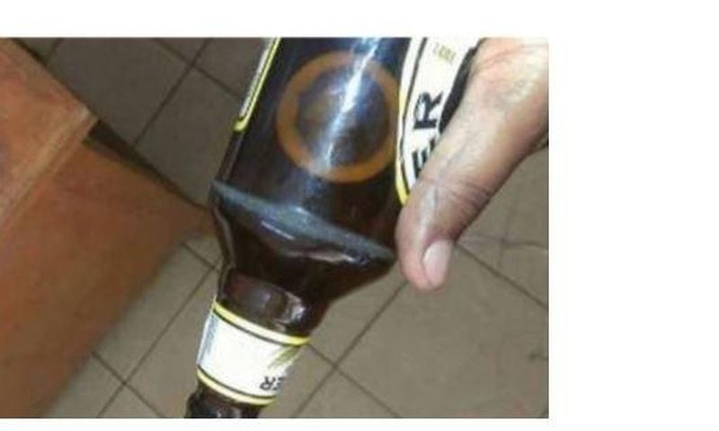 The condom in the beer bottle.