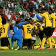 Jamaica's players celebrate after defeating Mexico 1-0 in their semi-final game during the 2017 CONCACAF Gold Cup on July 23, 2017