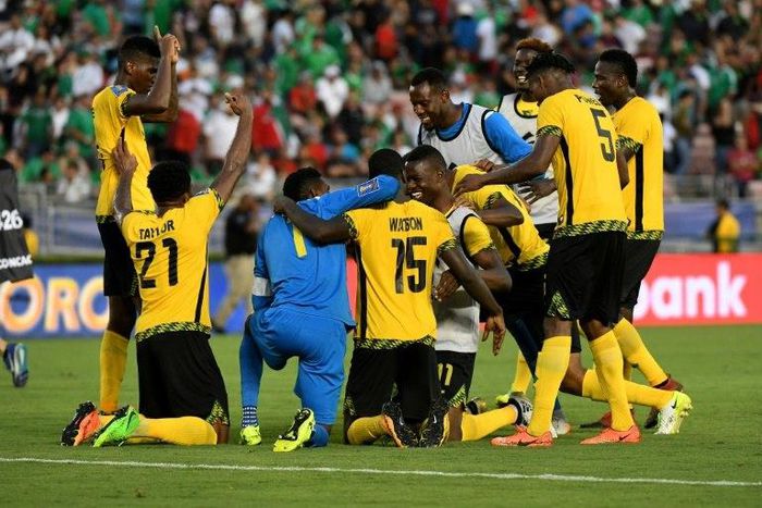 Jamaica's players celebrate after defeating Mexico 1-0 in their semi-final game during the 2017 CONCACAF Gold Cup on July 23, 2017