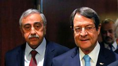 Greek Cypriot leader Nicos Anastasiades (R) and Turkish Cypriot leader Mustafa Akinci arrive for a meeting with UN Secretary-General Antonio Guterres, at UN headquarters in New York, on June 4, 2017