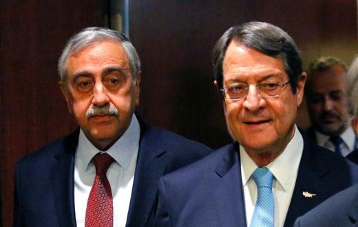Greek Cypriot leader Nicos Anastasiades (R) and Turkish Cypriot leader Mustafa Akinci arrive for a meeting with UN Secretary-General Antonio Guterres, at UN headquarters in New York, on June 4, 2017