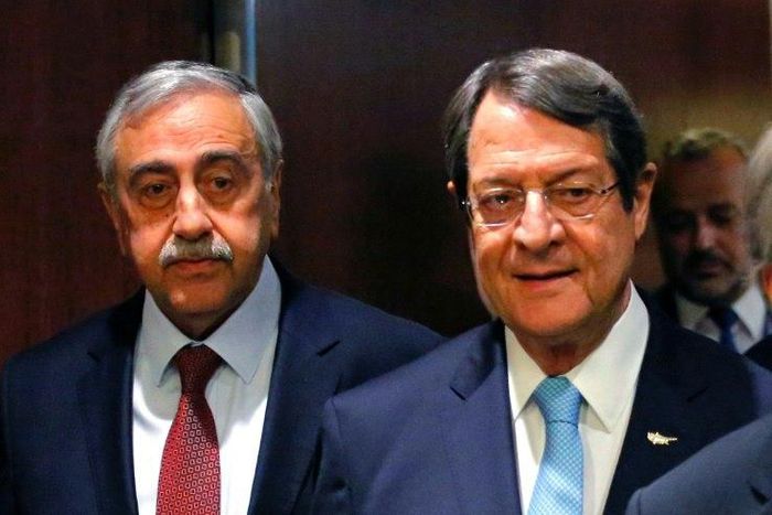 Greek Cypriot leader Nicos Anastasiades (R) and Turkish Cypriot leader Mustafa Akinci arrive for a meeting with UN Secretary-General Antonio Guterres, at UN headquarters in New York, on June 4, 2017