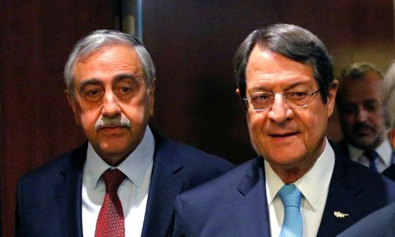 Greek Cypriot leader Nicos Anastasiades (R) and Turkish Cypriot leader Mustafa Akinci arrive for a meeting with UN Secretary-General Antonio Guterres, at UN headquarters in New York, on June 4, 2017