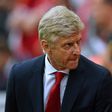 Arsenal's manager Arsene Wenger takes his seat for the English Premier League football match against Liverpool August 27, 2017