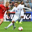 Russia's defender Igor Smolnikov (L) and Chile's forward Martin Rodriguez vie for the ball during a friendly football match in which Russia initially struggled but came back at the end of the game