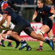 England's Sarah Bern (L) is tackled by France's Safi N'Diaye during the Women's Rugby World Cup 2017 semi-final match on August 22, 2017