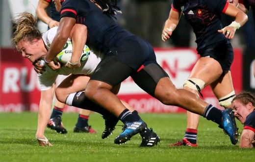 England's Sarah Bern (L) is tackled by France's Safi N'Diaye during the Women's Rugby World Cup 2017 semi-final match on August 22, 2017