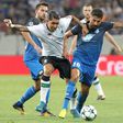 Hoffenheim midfielder Kerem Demirbay (R) grapples with Liverpool midfielder Roberto Firmino during the Champions League qualifier first leg in Sinsheim, Germany, on August 15, 2017