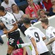 Liverpool's English midfielder Trent Alexander-Arnold (L) celebrates scoring his side's first goal in their Champions League qualifier against Hoffenheim in Sinsheim, Germany, on August 15, 2017