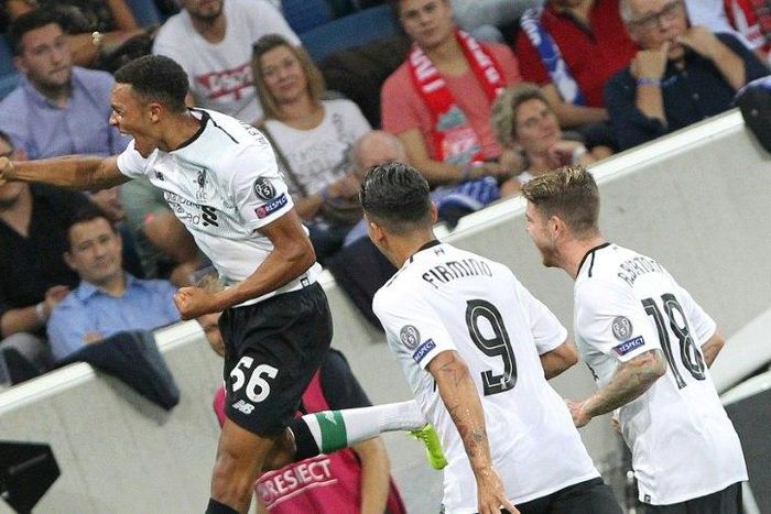 Liverpool's English midfielder Trent Alexander-Arnold (L) celebrates scoring his side's first goal in their Champions League qualifier against Hoffenheim in Sinsheim, Germany, on August 15, 2017