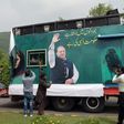 Pakistani supporters of deposed prime minister Nawaz Sharif gather around a container prepared for the rally led by Sharif in Islamabad