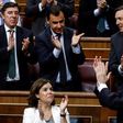 Spaain's Prime Minister Mariano Rajoy (R) is applauded by party colleagues at the Congress of Deputies in Madrid on June 14, 2017 after his party survived a vote of no confidence tabled to denounce a series of corruption scandals