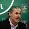 Former midfielder Emmanuel Petit was at the heart of Arsenal's glory days under embattled manager Arsene Wenger but he said fans risked fixating on that era without understanding the present