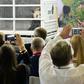 The excitement at the welcome press conference gave the pandas a taste of what might be to come in their new home