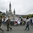 In keeping with security protocols in terror-scarred France, 300 police officers and soldiers were deployed to protect the worshippers in Lourdes, who were searched upon entry to the site