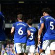Everton's English striker Wayne Rooney (C) celebrates scoring the opening goal during the English Premier League football match between Everton and Stoke City at Goodison Park in Liverpool, north west England on August 12, 2017
