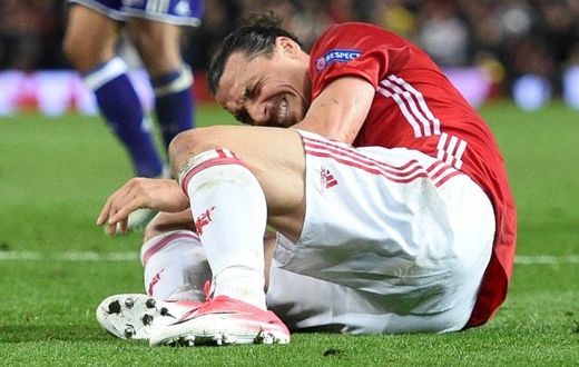 Zlatan Ibrahimovic reacts after injuring his knee during their UEFA Europa League quarter-final second leg football match against Anderlecht at Old Trafford in Manchester, on April 20, 2017