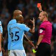 Manchester City's defender Kyle Walker is shown the red card by referee Robert Madley (R) on August 21, 2017