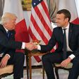 US President Donald Trump (L) and French President Emmanuel Macron (R) shake hands ahead of a working lunch, at the US ambassador's residence, on the sidelines of the NATO (North Atlantic Treaty Organization) summit, in Brussels, on May 25, 2017