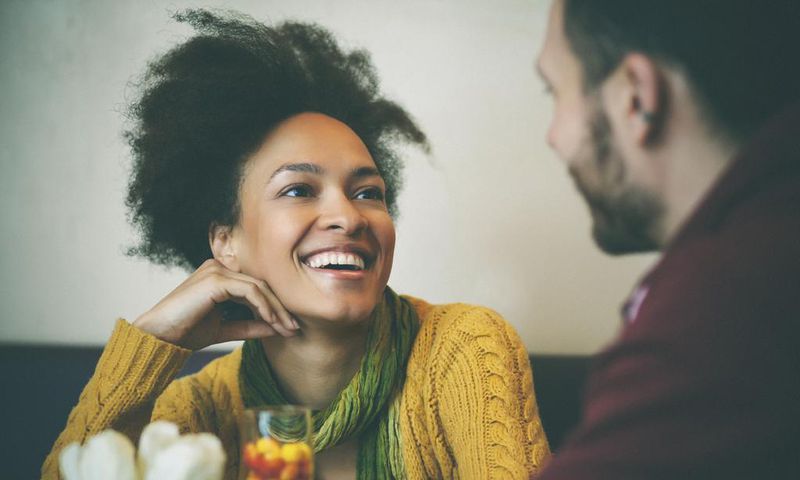 Happy woman on a date [Credit everyday feminism]