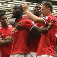 Manchester United's Romelu Lukaku celebrates with teammates after scoring a goal during their English Premier League match against West Ham United, at Old Trafford in Manchester, on August 13, 2017