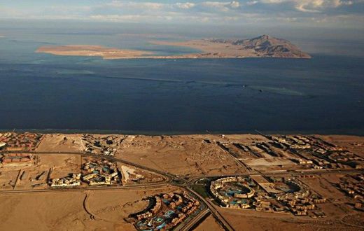 The Red Sea islands of Tiran (foreground) and Sanafir (background) are seen in the Strait of Tiran between Egypt's Sinai Peninsula and Saudi Arabia