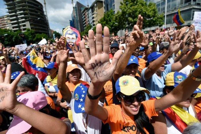 Thousands of opposition activists take part in a demonstration marking 100 days of protests against Venezuelan President Nicolas Maduro in Caracas, on July 9, 2017