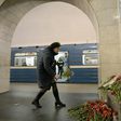 A woman places flowers in honour of the victims of the April 3 blast on the platform of Technological Institute metro station in Saint Petersburg on April 4, 2017