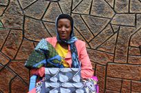 Joyce Kemunto a designer from Nyamira County expresses her first interaction with the Tanzanian khanga fabric at an Expo in Arusha, Tanzania, ignited her fashion creativity [Photo/Elizabeth Angira]