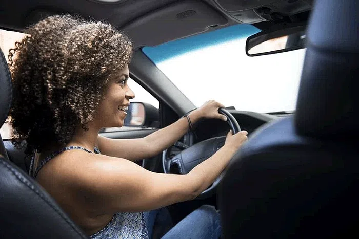 A person driving a car