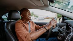 A person driving a car