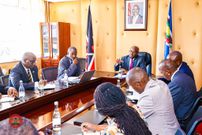 Principal Secretary for Internal Security Dr. Raymond Omollo chairs a meeting in his office