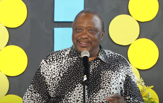 Former President Uhuru Kenyatta speaking during the burial of his cousin, Kibathi Muigai