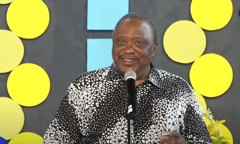 Former President Uhuru Kenyatta speaking during the burial of his cousin, Kibathi Muigai