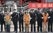 Chinese police parade a group of 15 convicted criminals to be sentenced in public