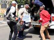 Plainclothes officers arrest a protesting man