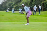 Division Two Lady Winner Betty Gacheru plays a putt during the NCBA Golf Series qualifying leg at Karen Country
